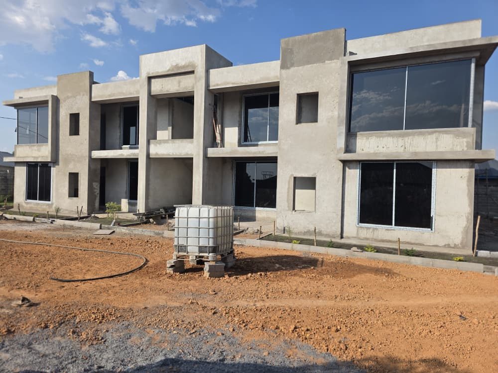 Modern multi-unit apartment blocks with large aluminium windows in finishing stage