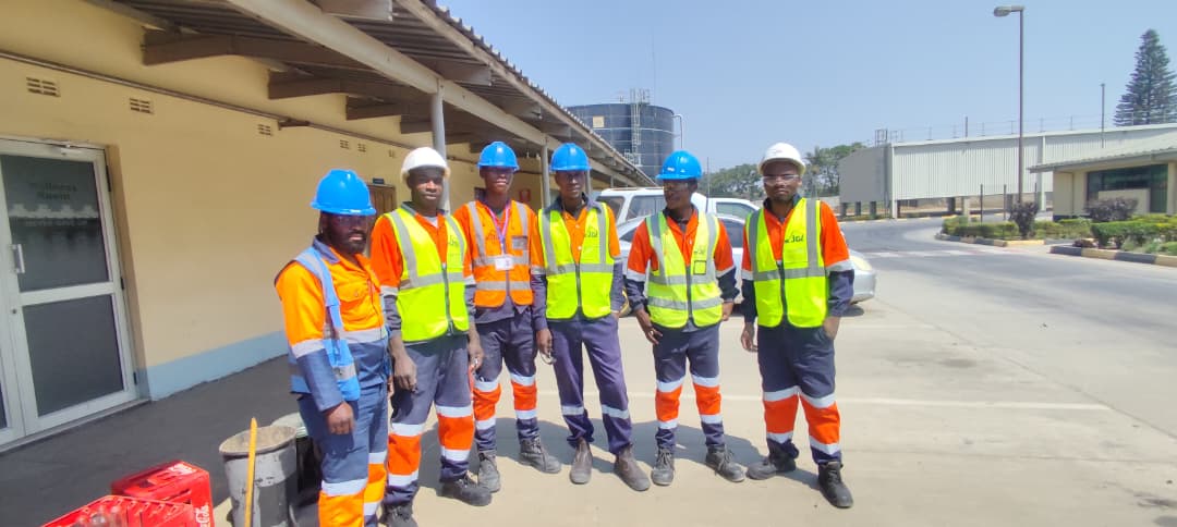 JCL electrical team wearing full protective equipment at an industrial site