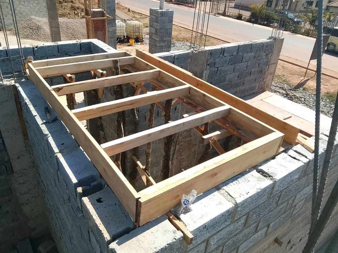Timber joists laid across block walls forming slab support formwork