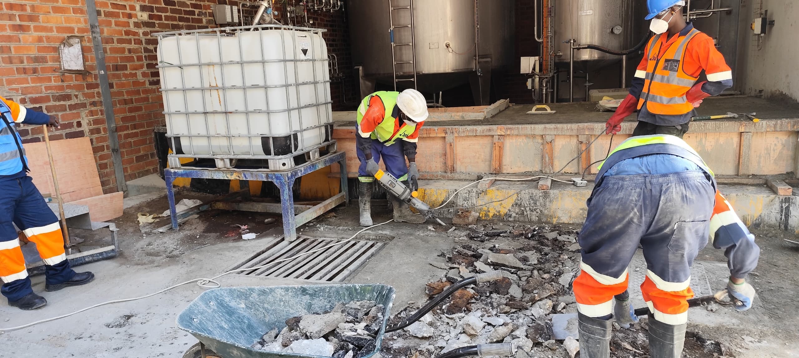 JCL crew carrying out concrete works at an industrial facility