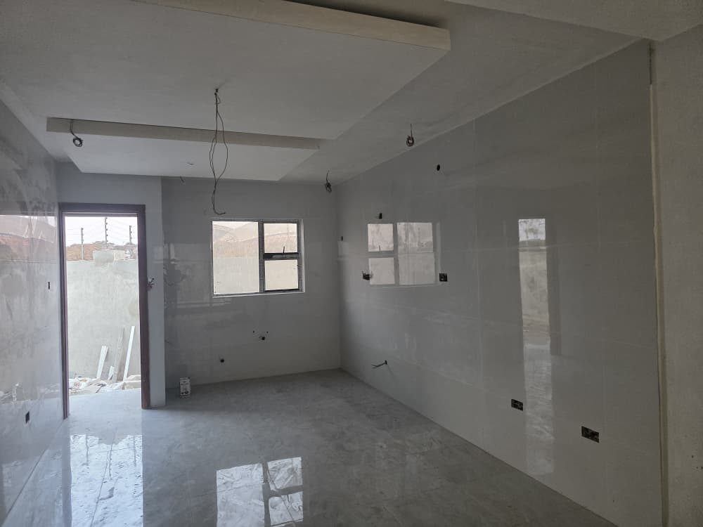 Glossy grey interior floor and wall finishes inside a new build