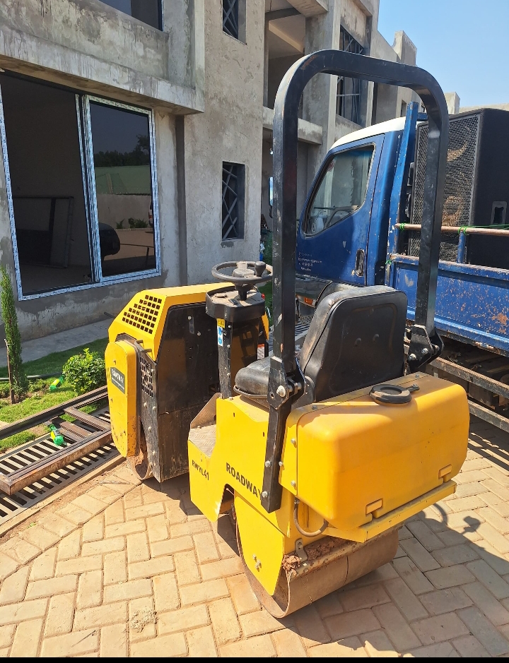 Yellow plate compactor ready for paving and ground preparation works