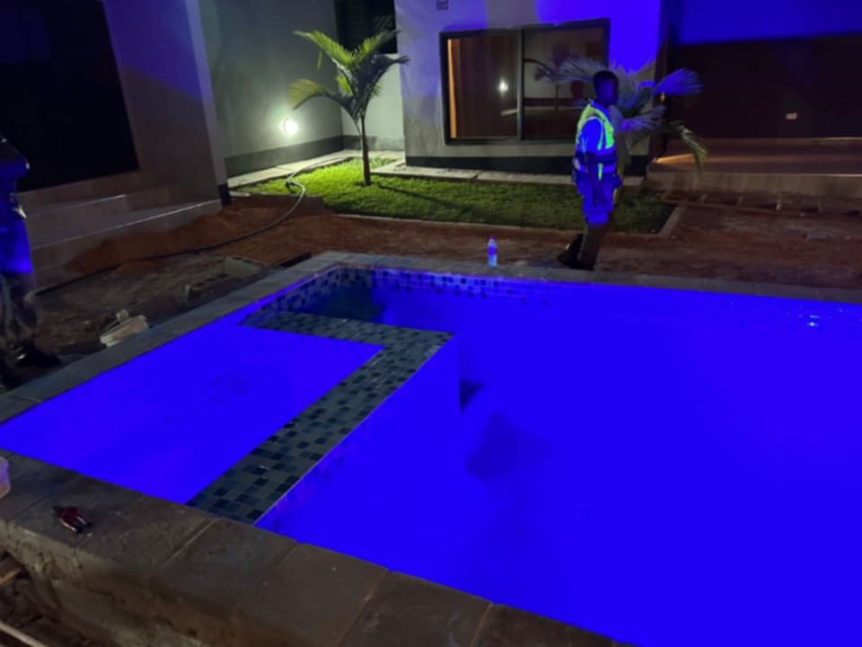 Illuminated swimming pool under construction by JCL, ready for handover